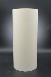 Newsprint roll upright with a black background