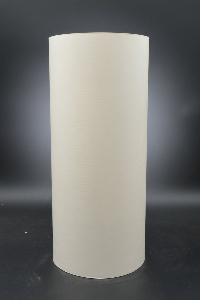 Newsprint roll upright with a black background