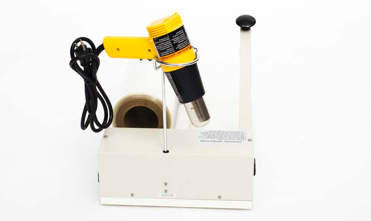 Side view of I bar sealer with heat gun and rack