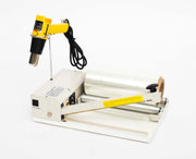 I bar sealer with heat gun and roll of film